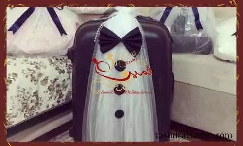 تزیین چمدان به صورت عروس و دامادی