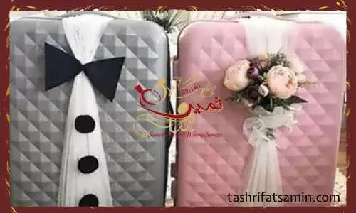تزیین چمدان به شکل لباس عروس و داماد